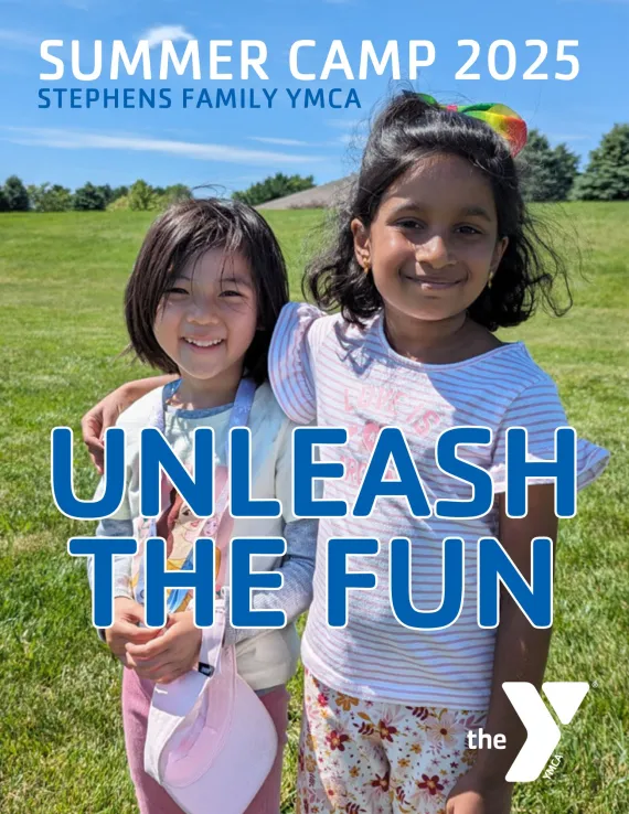 Text reads: Summer Camp 2025, Stephens Family YMCA Unleash the fun. Two kids are hugging and smiling at the camera